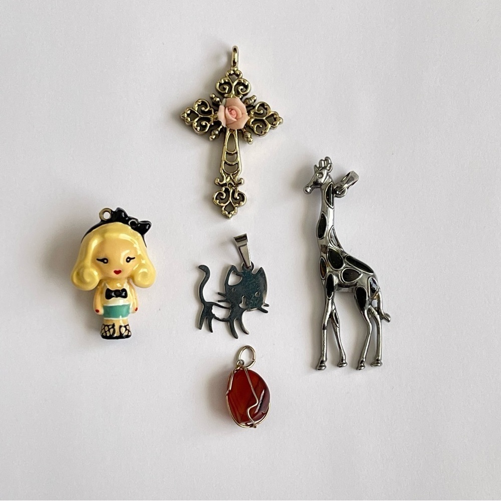 Lot of five pendants necklaces giraffe cat doll cross stone